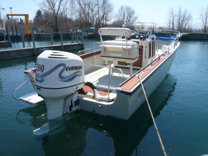 1980 Outrage 22 with 2000 Evinrude 200. Superconsole, hydraulic steering, mills bimini and 2000 vintage OEM helm seat/storage/back rest
